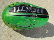 Green dirtbike helmet with stars and old school flames