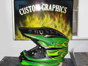 Green dirtbike helmet with stars and old school flames