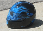 True fire blue skull full face motorcycle helmet with spine and brain exposed as well as airbushed visor.
