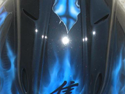 True fire blue skull full face motorcycle helmet with spine and brain exposed as well as airbushed visor.